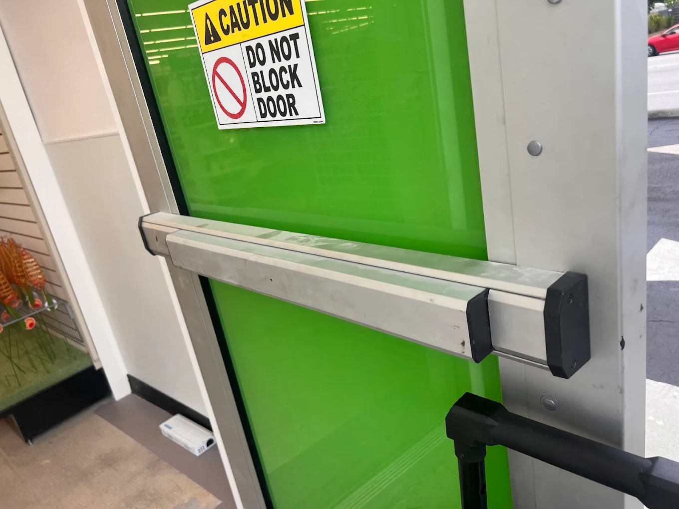 Mobile locksmith replacing automotive ignition cylinder at customer location with diagnostic equipment connected